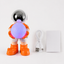 Inhoud met oranje astronaut speaker, USB-oplaadkabel en handleiding